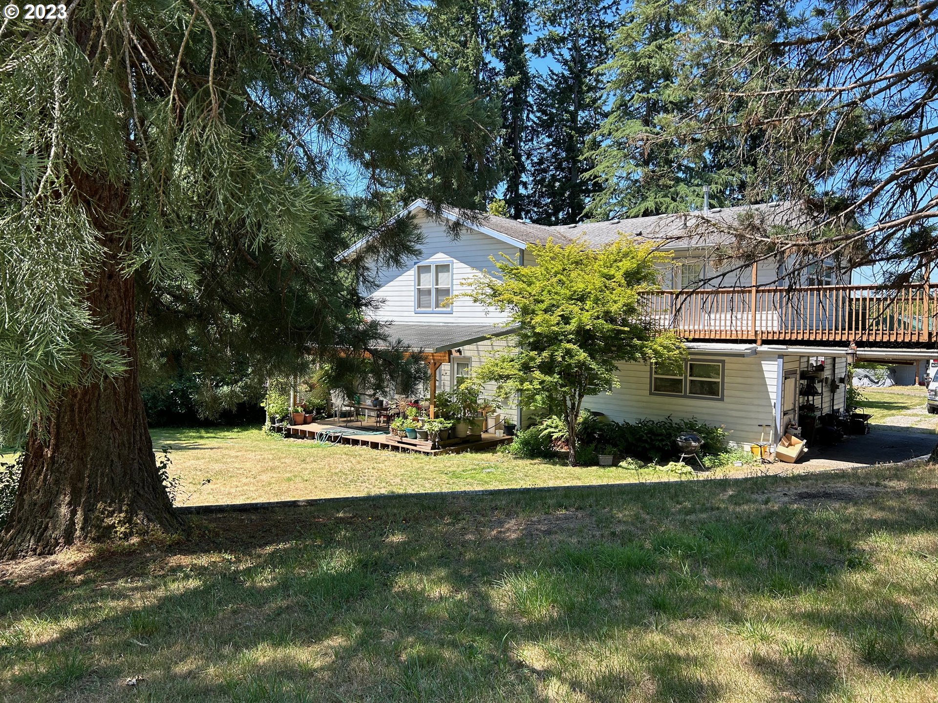16400 Highway 224 Damascus, OR 97089 - Photo 12 of 16 a view of a house with a big yard and large trees