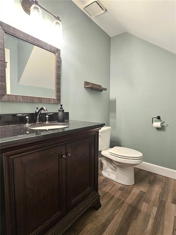 290 Oakmere Road Alpharetta, GA 30009 - Photo 10 of 26 a bathroom with a toilet sink and mirror