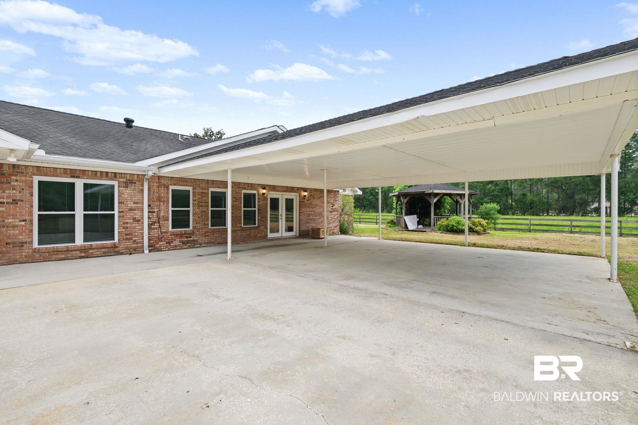 7540 2 Mile Road Irvington, AL 36544 - Photo 57 of 82 Expansive covered carport with concrete paving