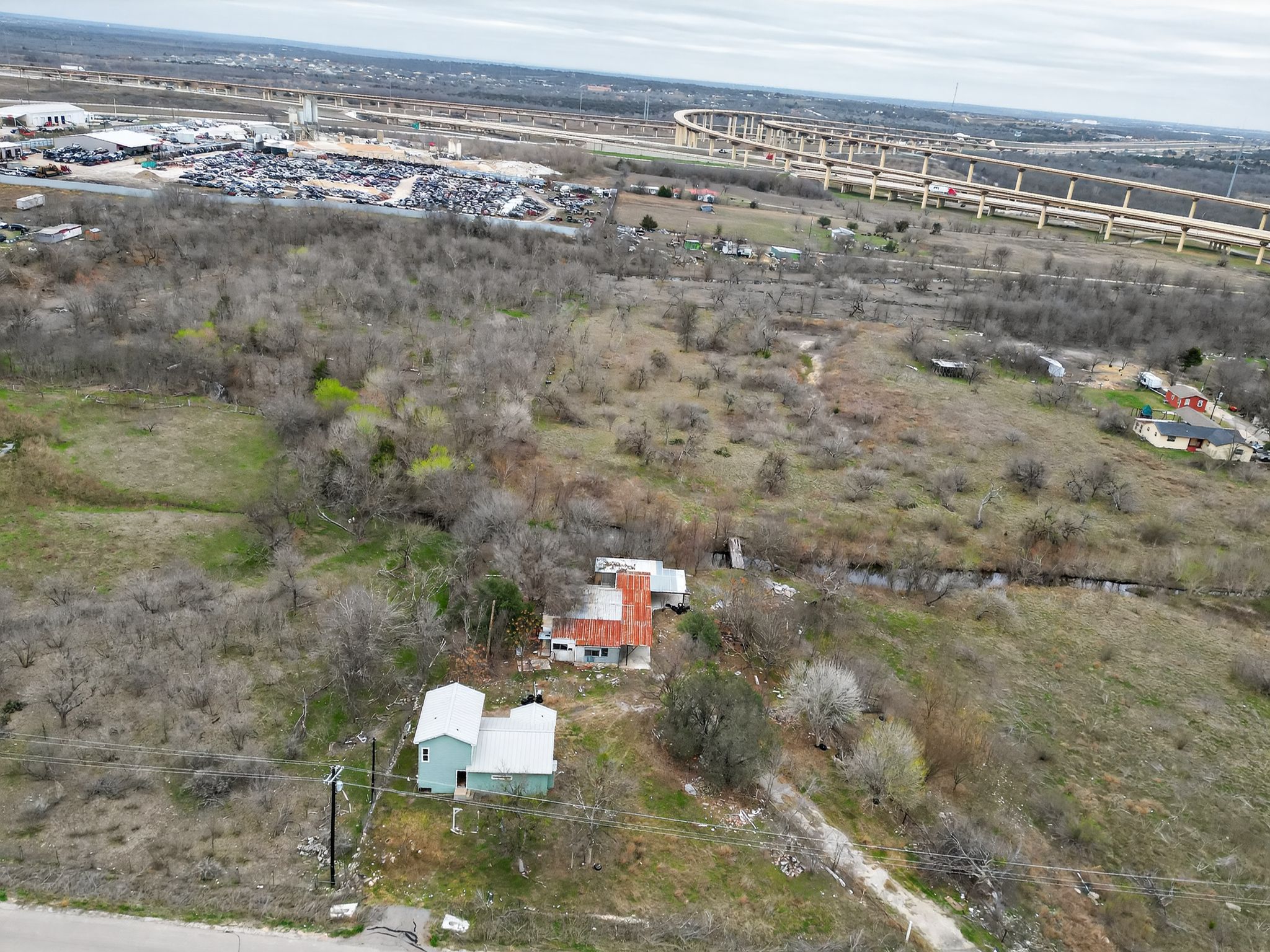 11223 Tom Sassman Road Austin, TX 78747 - Photo 28 of 40 View of property location featuring industrial structures