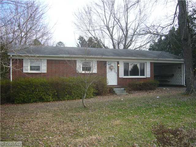 Exterior Front. This full brick 3 bedroom home features replacement vinyl insulated windows and exterior vinyl trim.  The home also includes a one car carport, central air and heat with an energy efficient heat pump system, and .7 Acre lot.