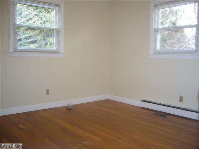 Exterior Front. All of the bedrooms feature the natural hardwood floors, great insulated replacement windows, new overhead lighting and blinds.