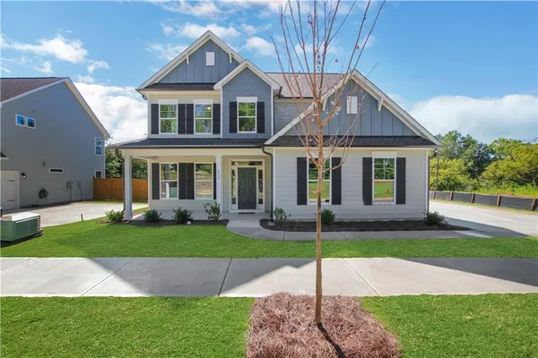 a front view of a house with a yard