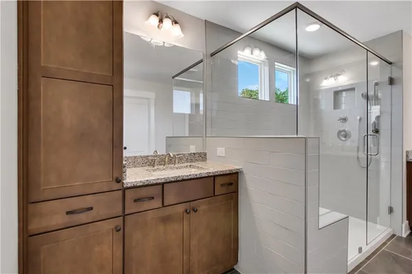 a bathroom with a sink and mirror