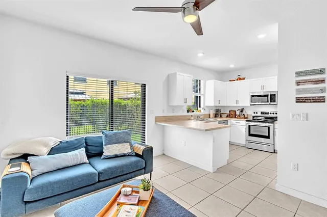 a kitchen with stainless steel appliances a refrigerator sink and stove