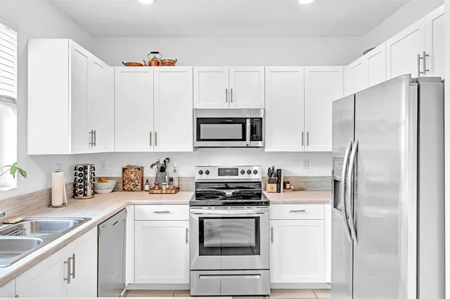 a kitchen that has a sink and a window