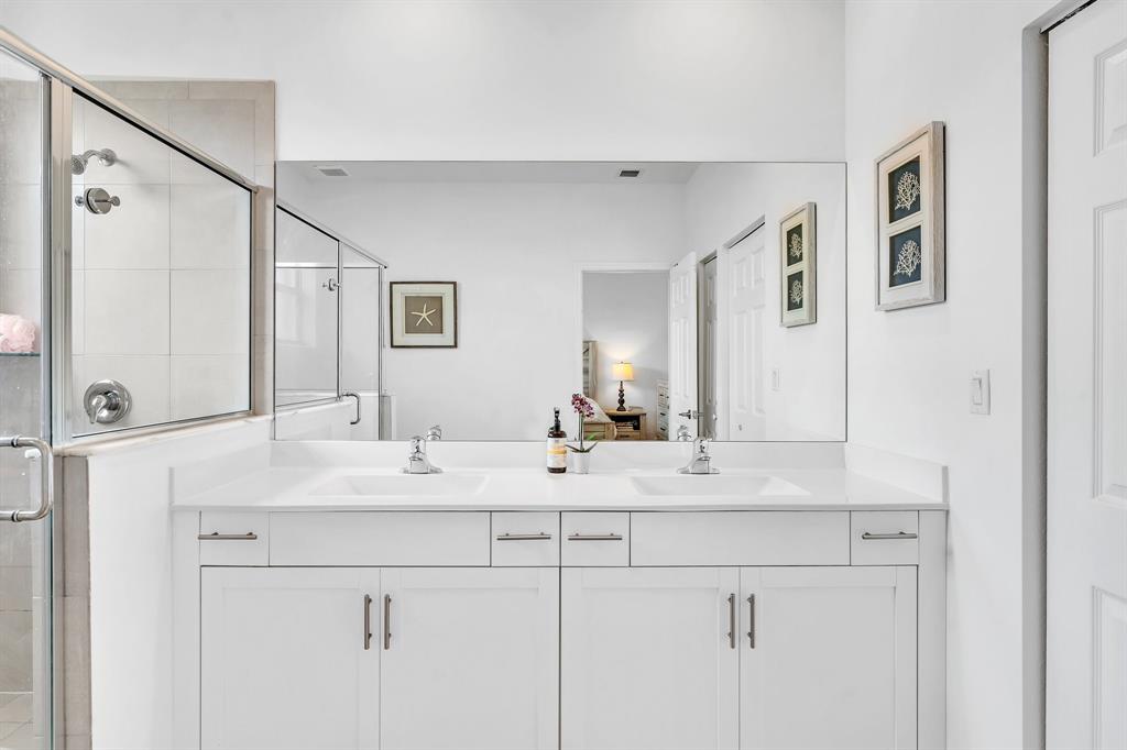 4668 Banker Terrace Davie, FL 33314 - Photo 39 of 52 a bathroom with double sink and a mirror