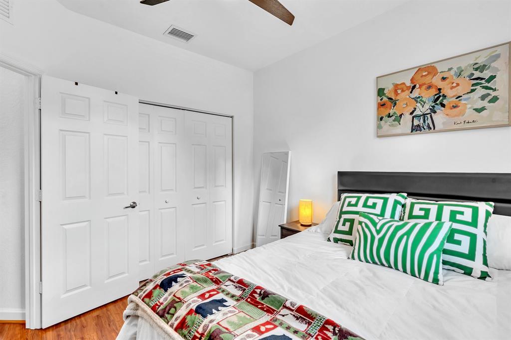 4668 Banker Terrace Davie, FL 33314 - Photo 42 of 52 a bedroom with a bed and a painting on the wall