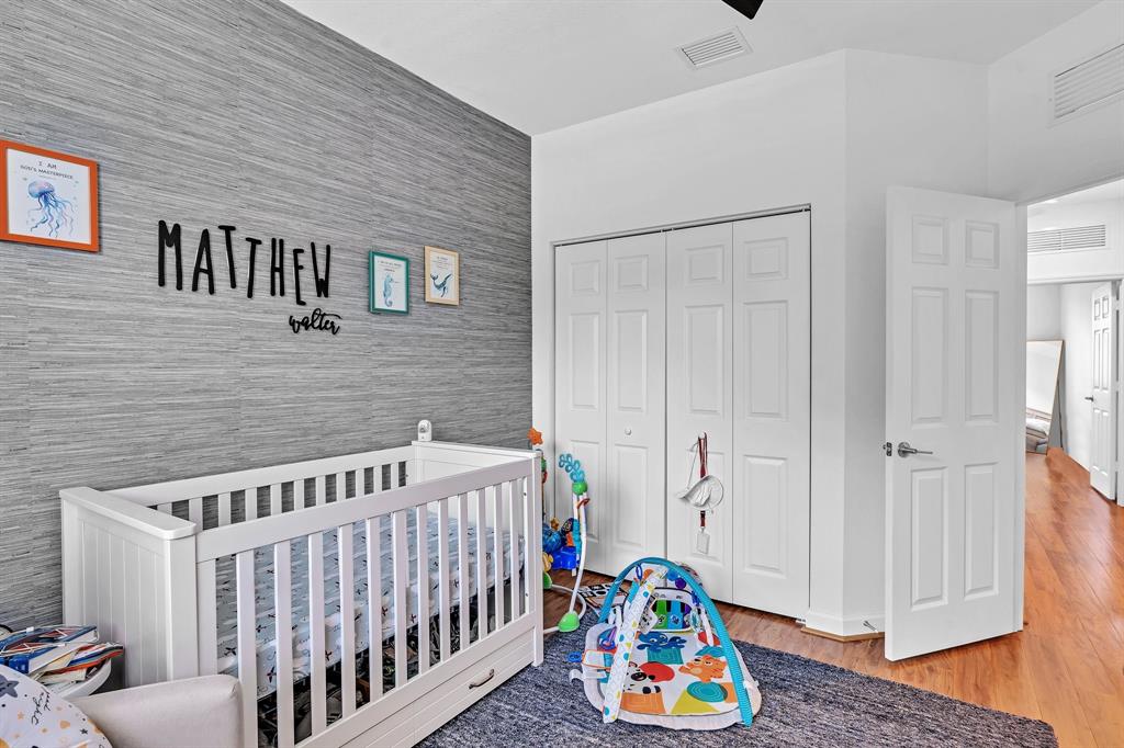 4668 Banker Terrace Davie, FL 33314 - Photo 46 of 52 a bedroom with a baby crib lounge chair and a windows