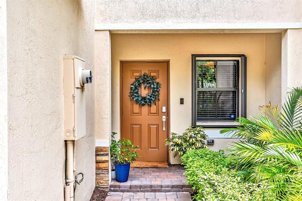 4668 Banker Terrace Davie, FL 33314 - Photo 5 of 52 a front view of a house with a potted plant