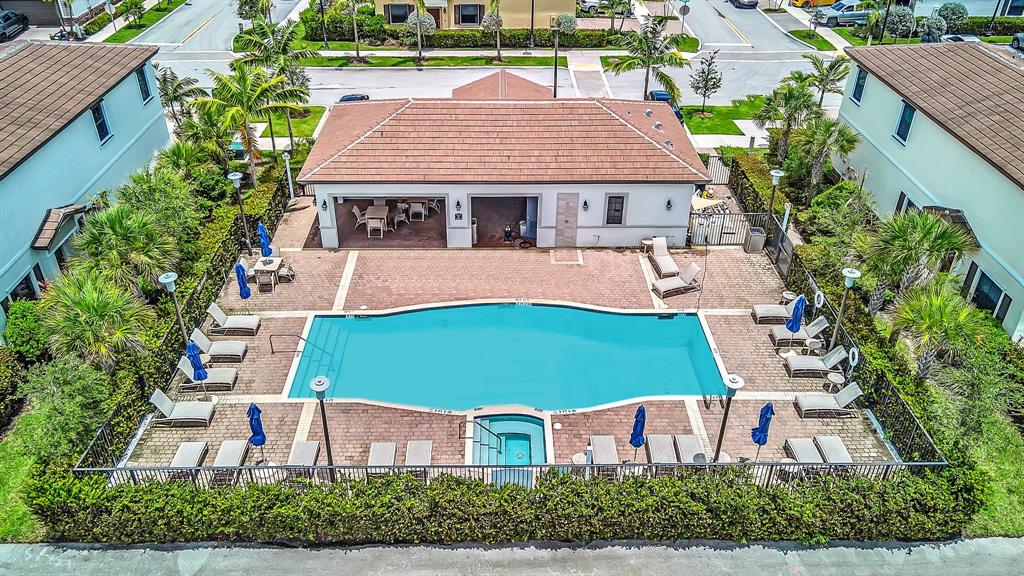 4668 Banker Terrace Davie, FL 33314 - Photo 52 of 52 an aerial view of a house with a swimming pool patio and outdoor seating