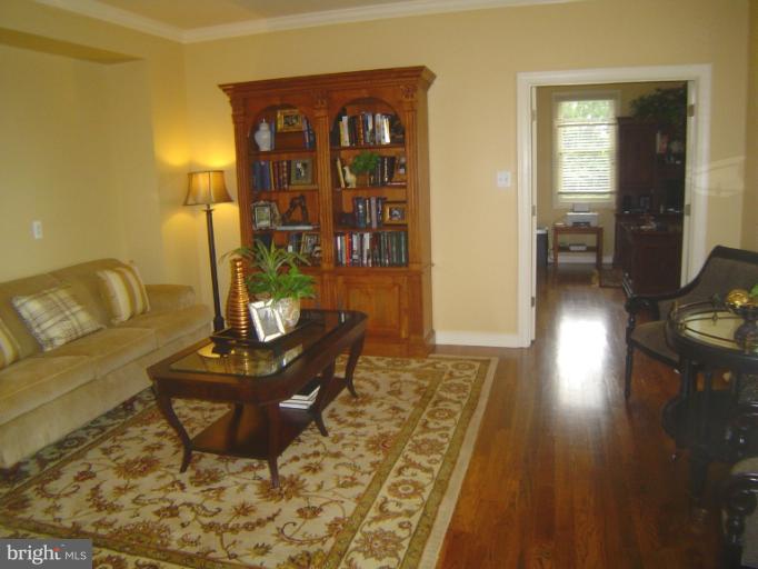 4908 Round Hill Road Frederick, MD 21702 - Photo 14 of 24 a living room with furniture and a wooden floor