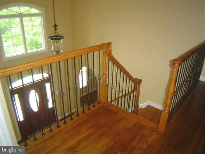 4908 Round Hill Road Frederick, MD 21702 - Photo 3 of 24 a view of staircase with large window