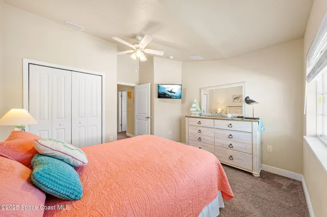 a bathroom with a granite countertop sink toilet mirror and shower
