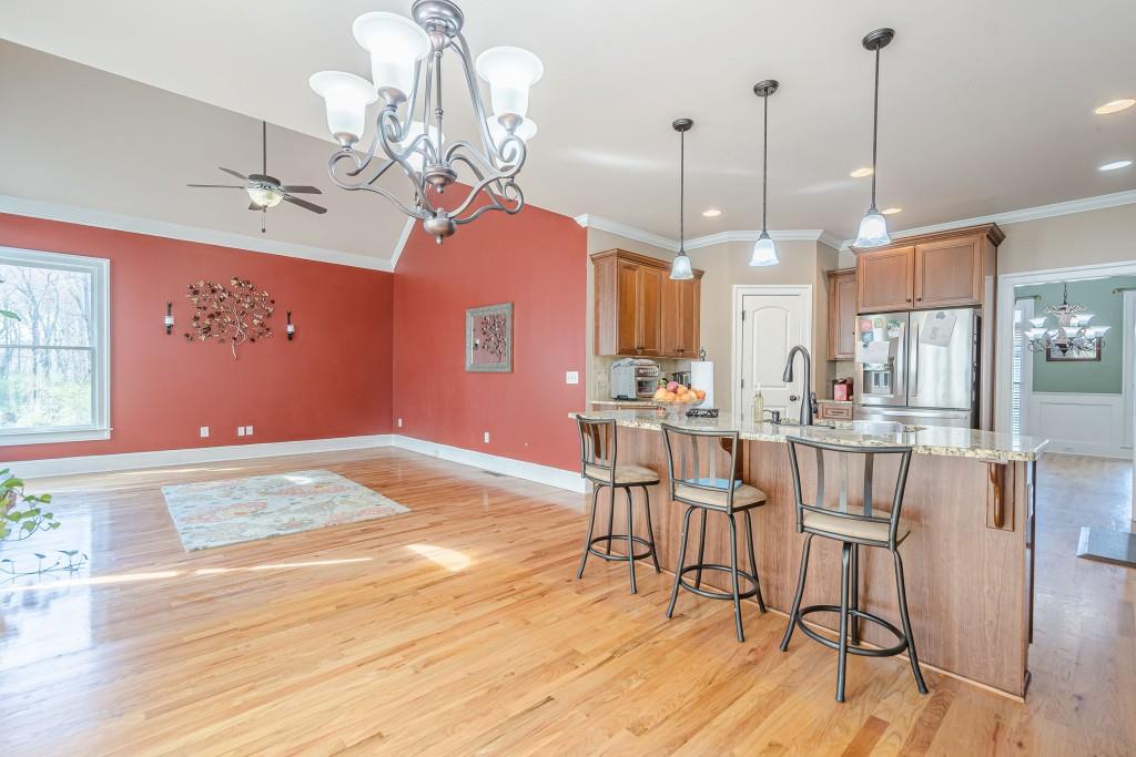 1765 Dew Place Southwest Marietta, GA 30064 - Photo 22 of 61 a view of a dining room with furniture wooden floor and chandelier