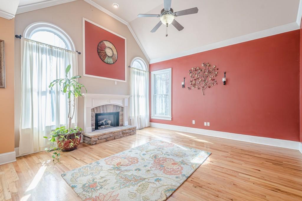 1765 Dew Place Southwest Marietta, GA 30064 - Photo 23 of 61 a view of a livingroom with an empty space and a fireplace