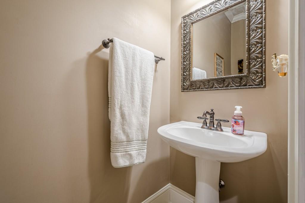 1765 Dew Place Southwest Marietta, GA 30064 - Photo 25 of 61 a bathroom with a sink and mirror