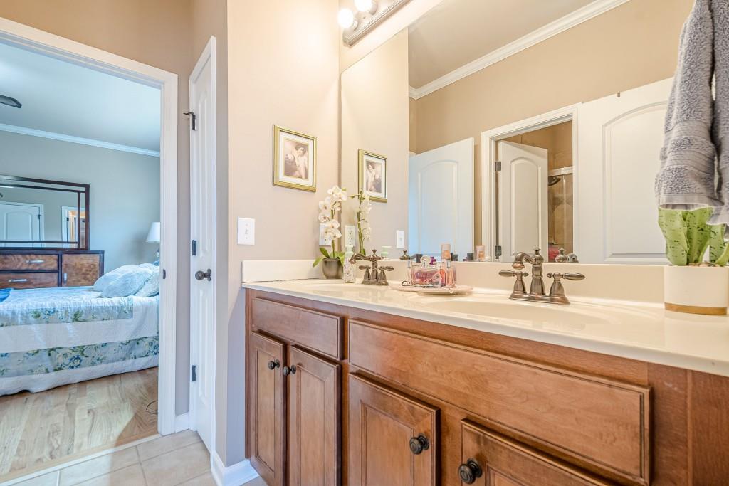 1765 Dew Place Southwest Marietta, GA 30064 - Photo 35 of 61 a bathroom with a sink and a mirror