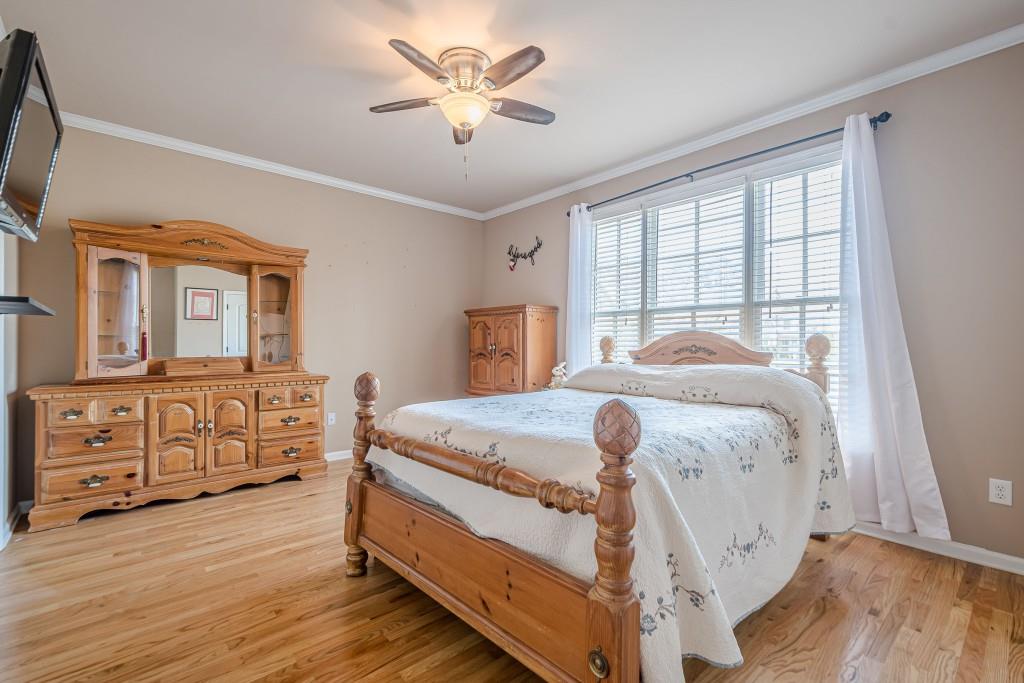 1765 Dew Place Southwest Marietta, GA 30064 - Photo 36 of 61 a bedroom with a bed and a dresser