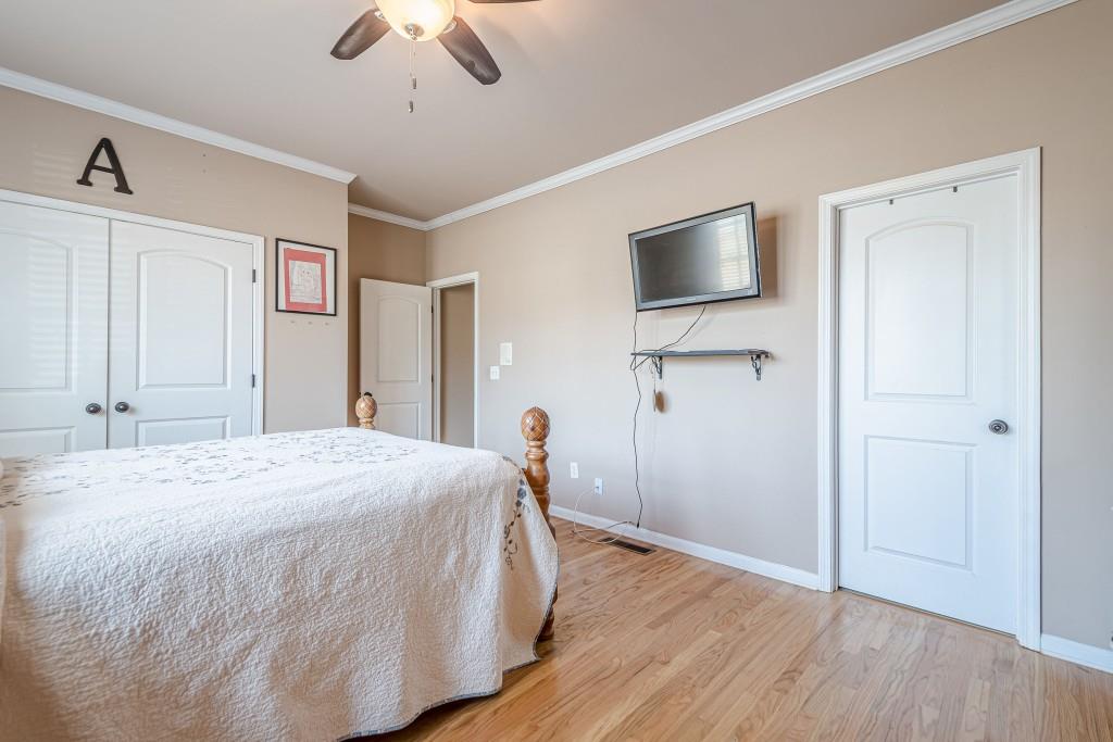 1765 Dew Place Southwest Marietta, GA 30064 - Photo 37 of 61 a bedroom with a bed and a flat screen tv
