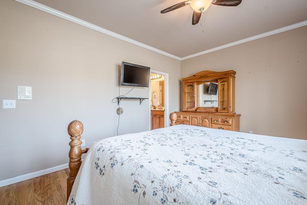 1765 Dew Place Southwest Marietta, GA 30064 - Photo 38 of 61 a bedroom with a bed and a chandelier