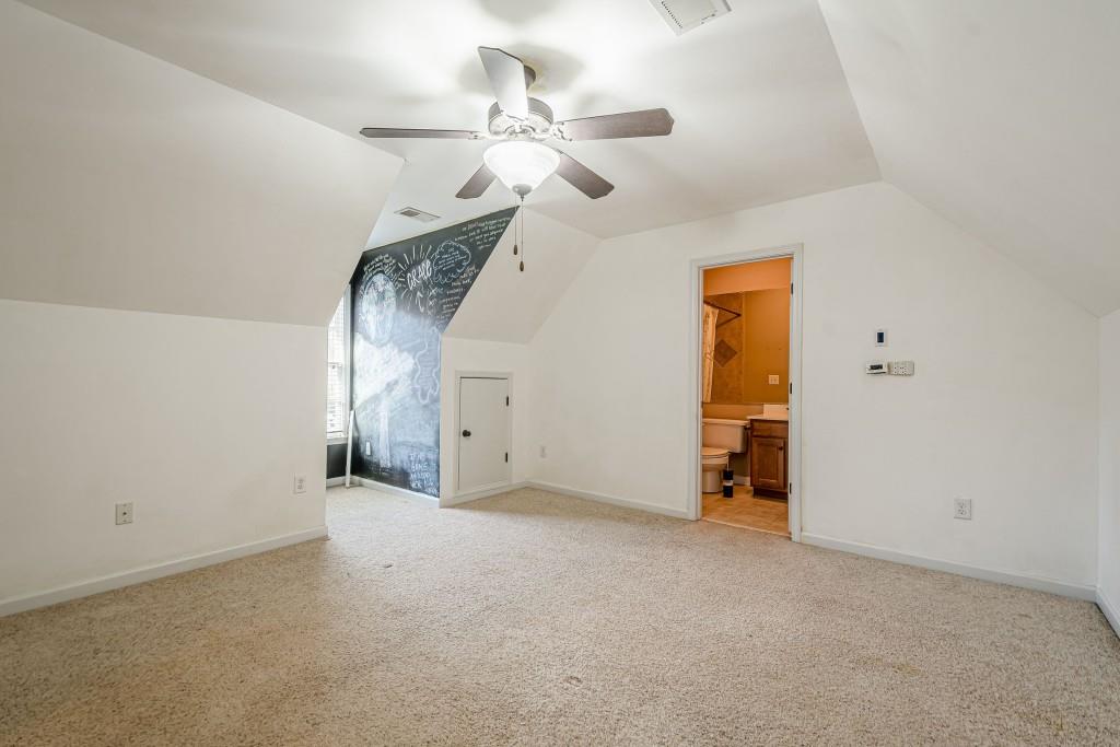 1765 Dew Place Southwest Marietta, GA 30064 - Photo 40 of 61 an empty room with a ceiling fan and a window
