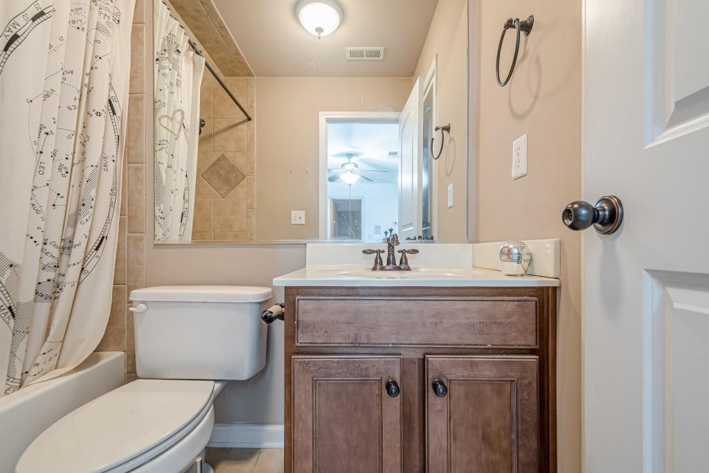 1765 Dew Place Southwest Marietta, GA 30064 - Photo 41 of 61 a bathroom with a sink a toilet and a mirror