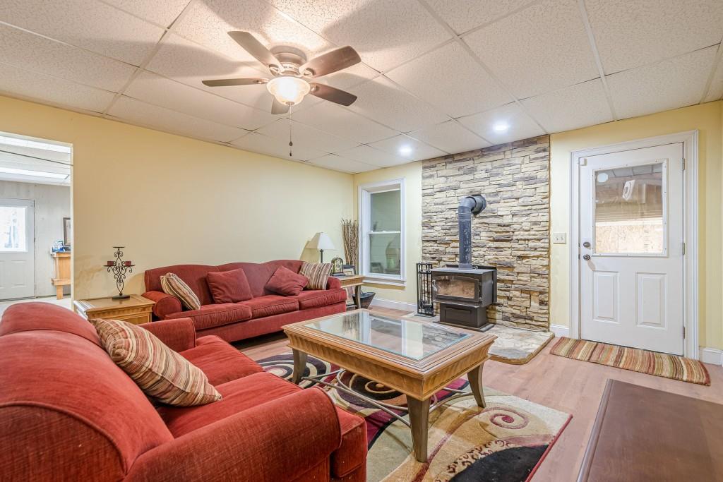1765 Dew Place Southwest Marietta, GA 30064 - Photo 43 of 61 a living room with furniture a table and a fireplace