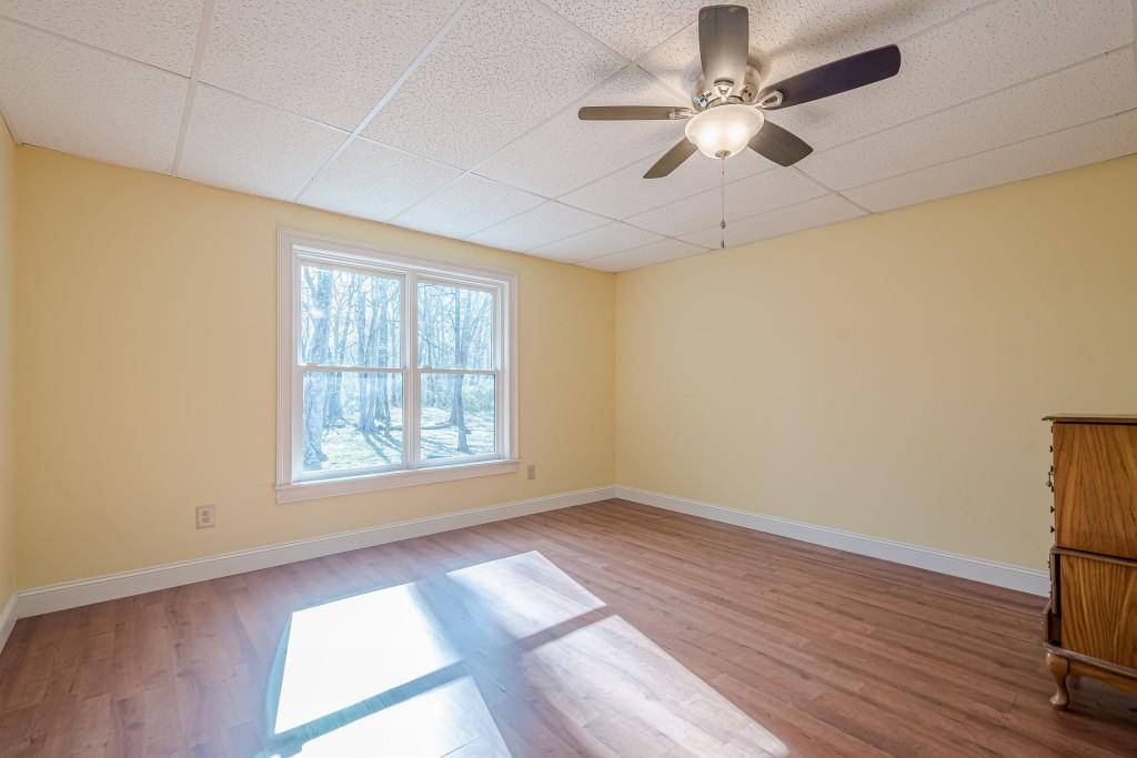 1765 Dew Place Southwest Marietta, GA 30064 - Photo 50 of 61 wooden floor in an empty room with a window