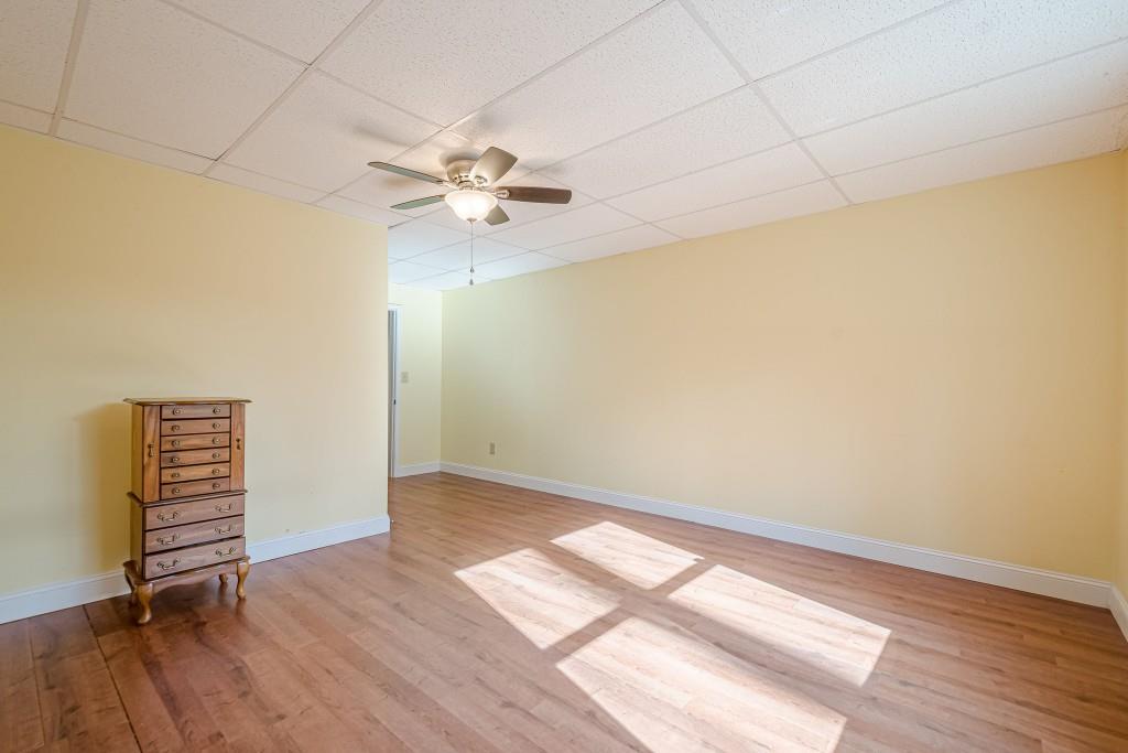 1765 Dew Place Southwest Marietta, GA 30064 - Photo 51 of 61 wooden floor in an empty room with a window