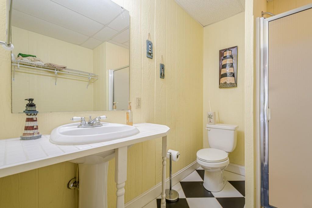 1765 Dew Place Southwest Marietta, GA 30064 - Photo 52 of 61 a bathroom with a sink a toilet and shower