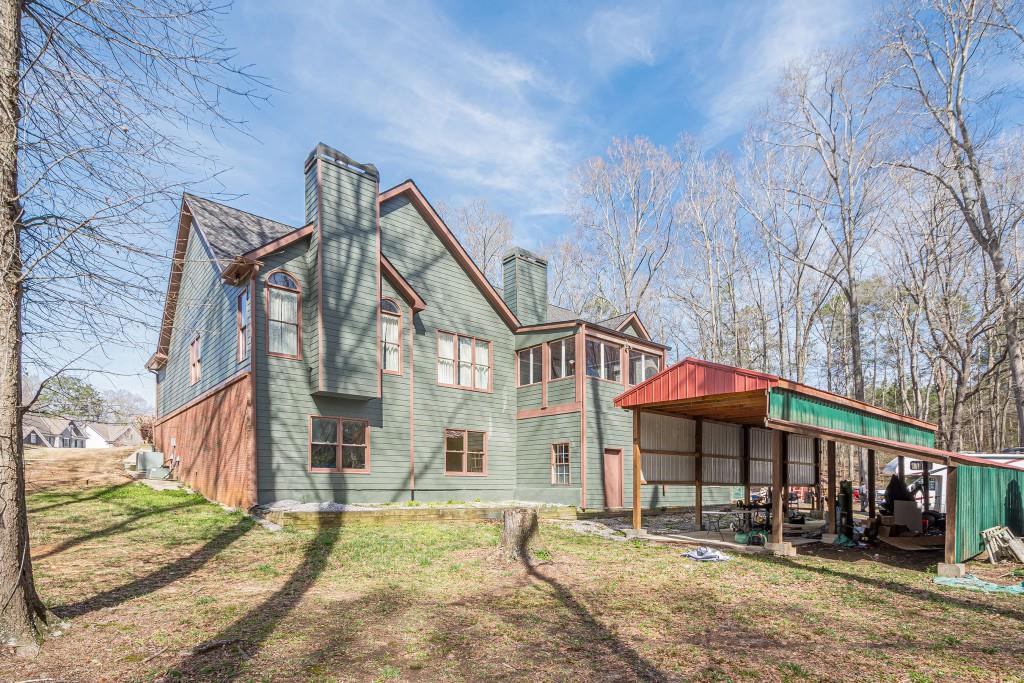 1765 Dew Place Southwest Marietta, GA 30064 - Photo 56 of 61 a front view of a house with a yard