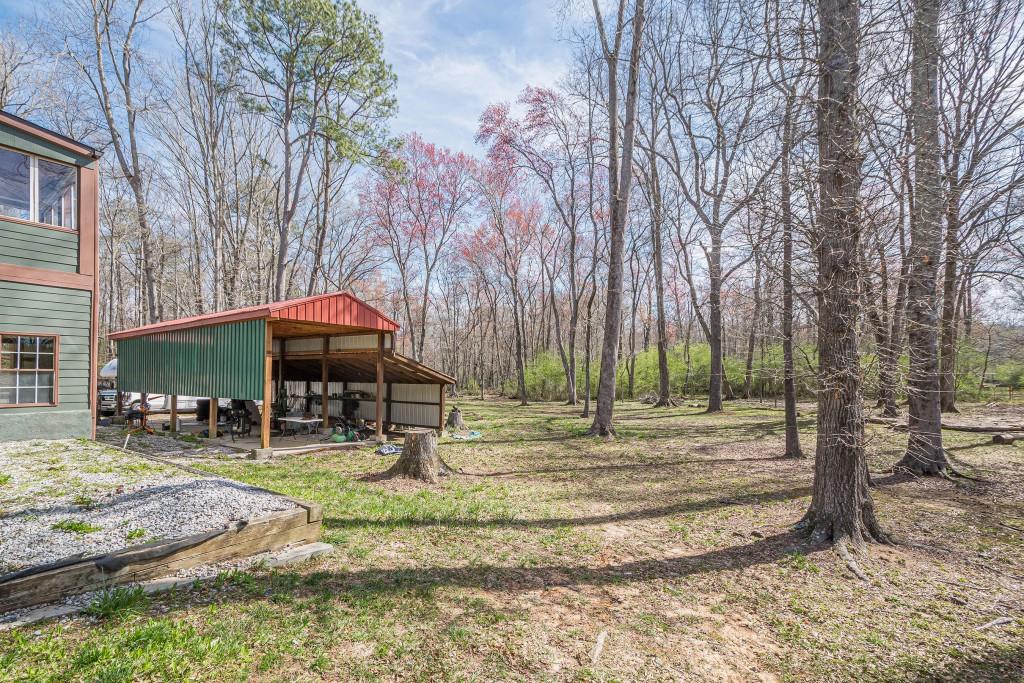 1765 Dew Place Southwest Marietta, GA 30064 - Photo 57 of 61 a backyard of a house with barbeque oven tree and outdoor seating