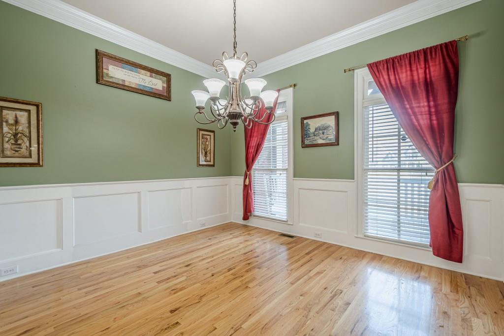 1765 Dew Place Southwest Marietta, GA 30064 - Photo 6 of 61 a view of a livingroom with wooden floor and chandelier