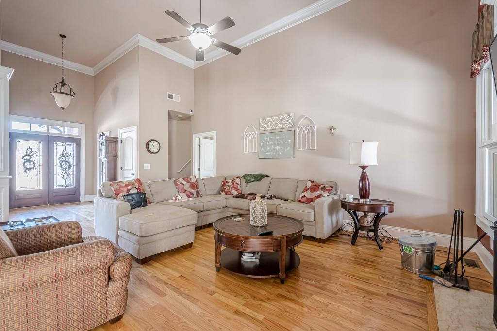 1765 Dew Place Southwest Marietta, GA 30064 - Photo 10 of 61 a living room with furniture and a wooden floor