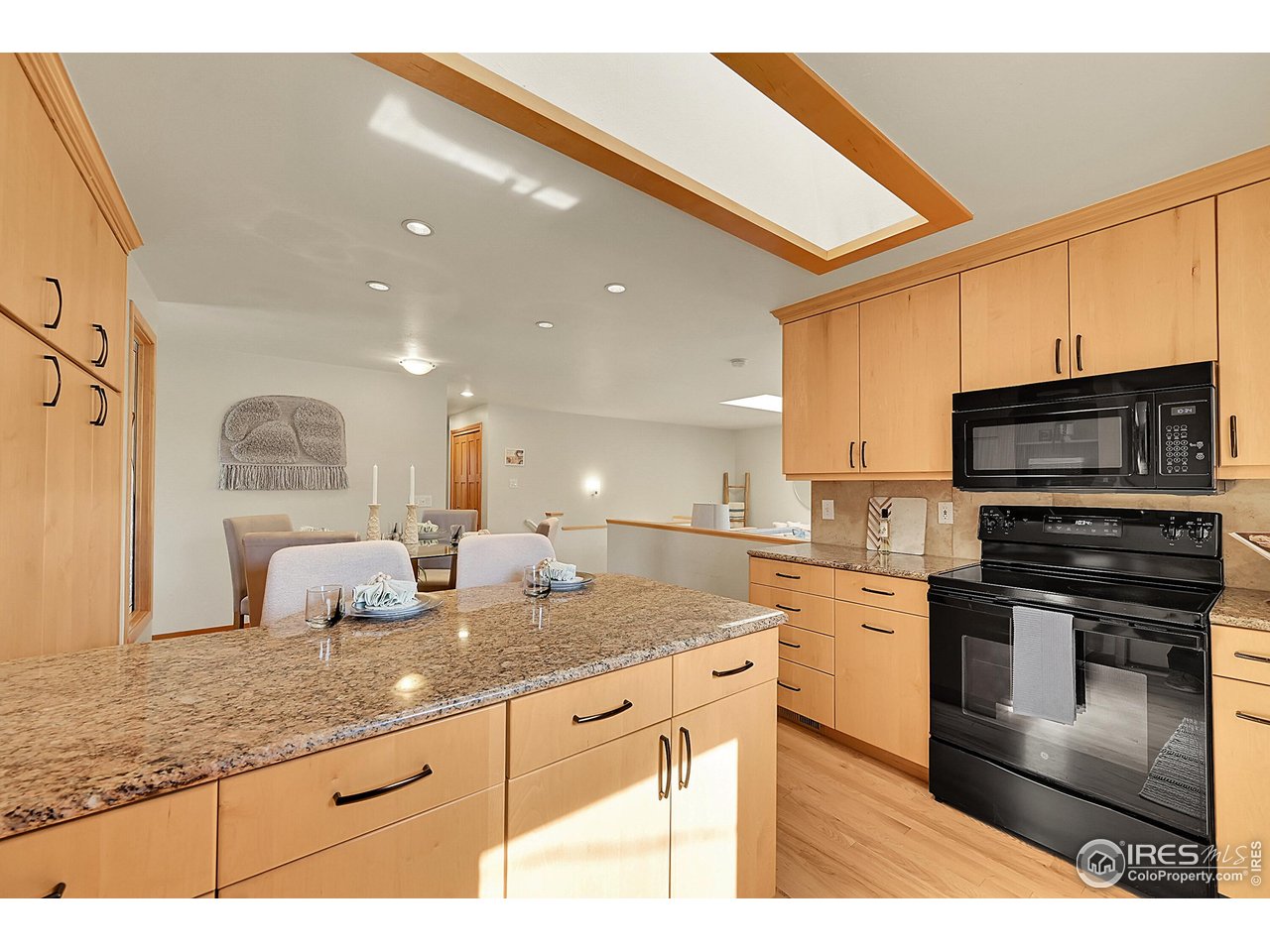 960 Toedtli Drive Boulder, CO 80305 - Photo 11 of 50 a kitchen with stainless steel appliances granite countertop a sink stove and oven