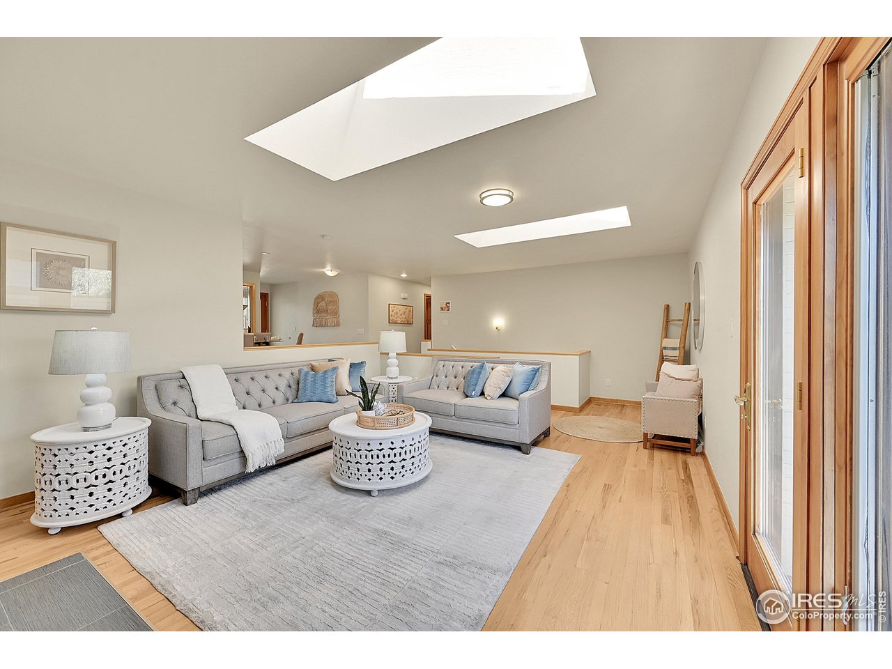 960 Toedtli Drive Boulder, CO 80305 - Photo 17 of 50 a living room with couches and a flat screen tv