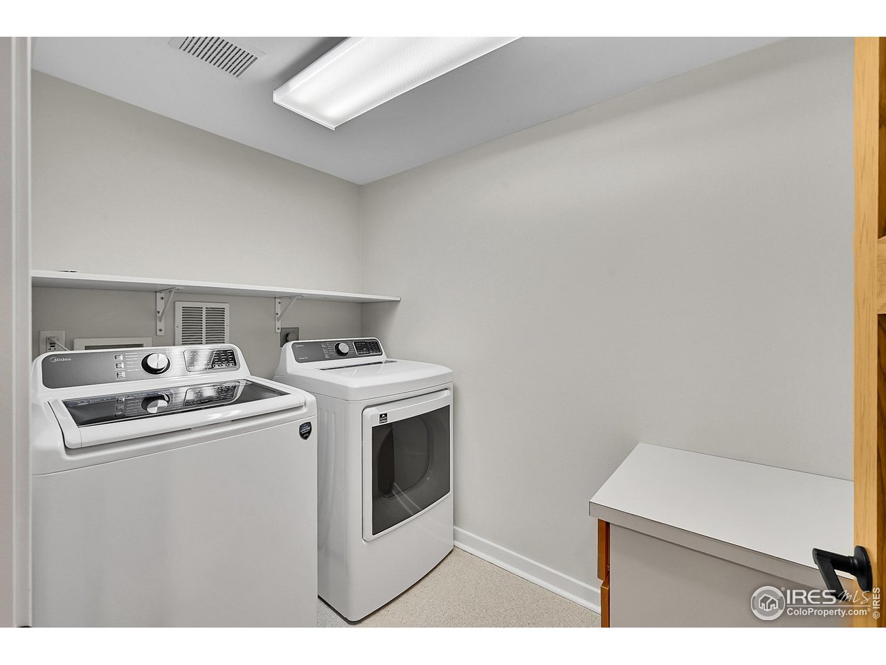 960 Toedtli Drive Boulder, CO 80305 - Photo 29 of 50 a utility room with dryer and washer