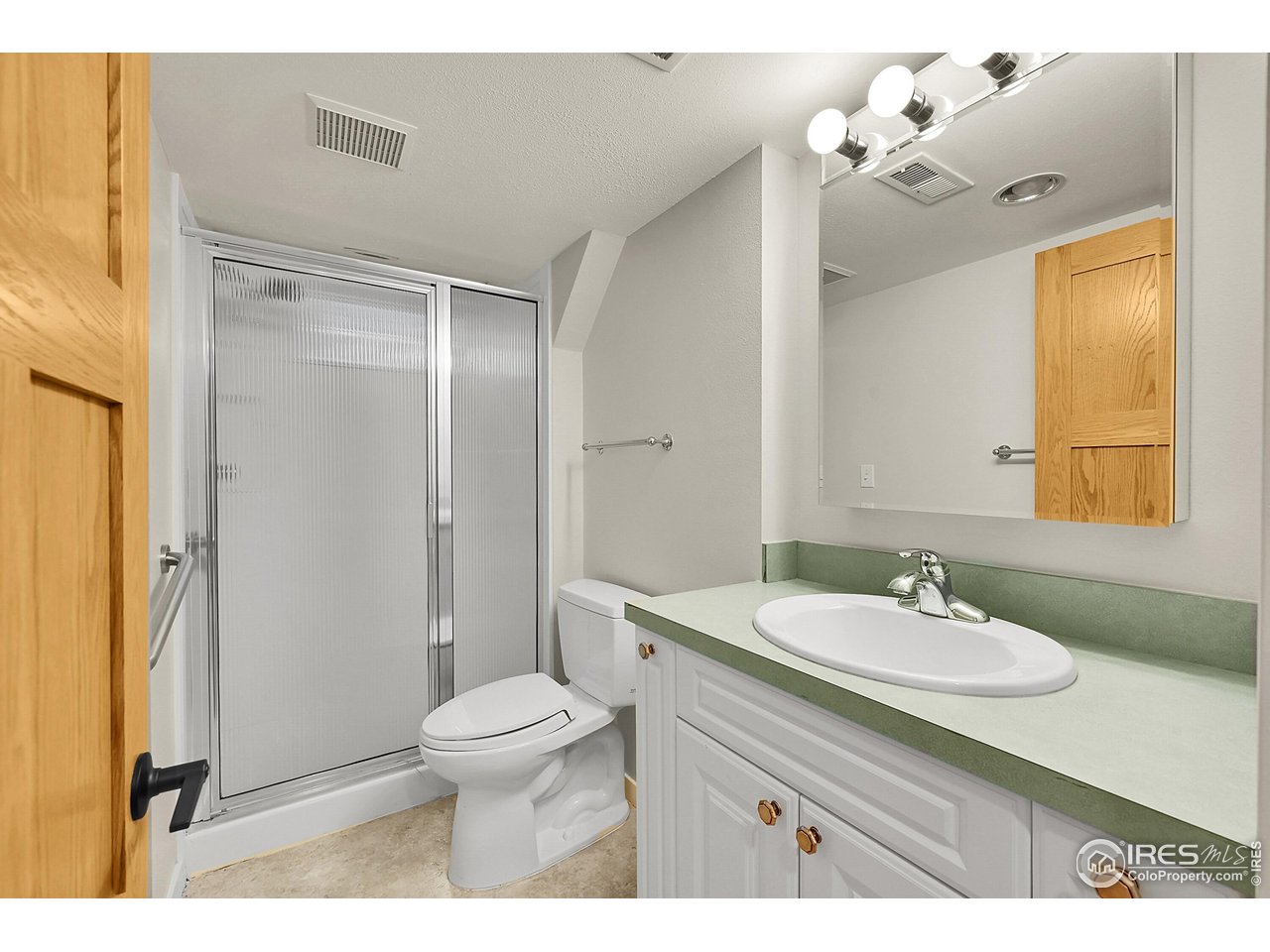 960 Toedtli Drive Boulder, CO 80305 - Photo 30 of 50 a bathroom with a sink a toilet a mirror and shower