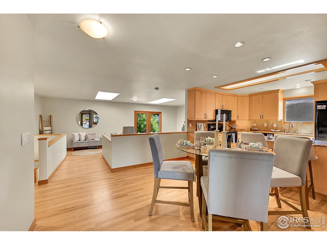 960 Toedtli Drive Boulder, CO 80305 - Photo 5 of 50 a living room with lots of furniture and kitchen view