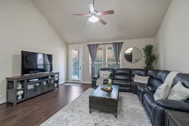 a living room with furniture kitchen and a kitchen view