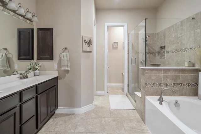 a bathroom with a double vanity sink and a mirror
