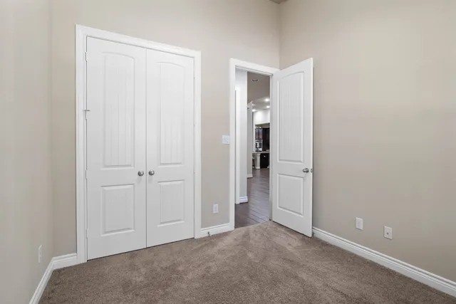 a bathroom with a sink a toilet a shower and a mirror