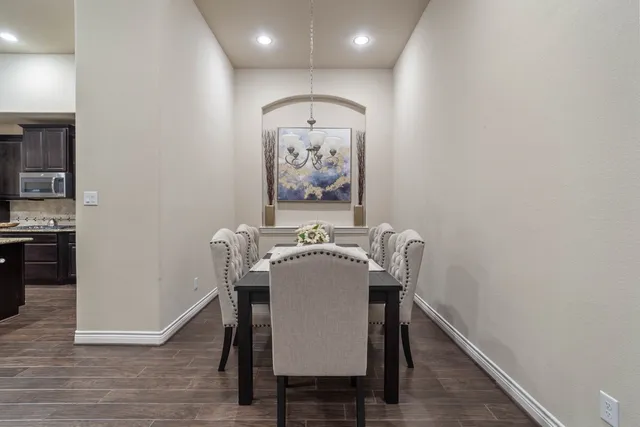 a view of a dining area with furniture and wooden floor