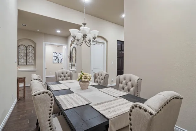 a view of a very nice looking dining room with furniture