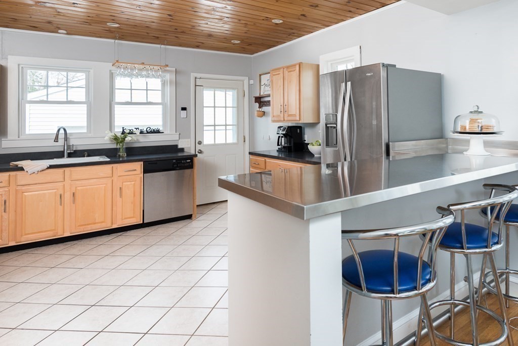 39 Edgemont Road Braintree, MA 02184 - Photo 12 of 39 a kitchen with stainless steel appliances a sink a refrigerator and window