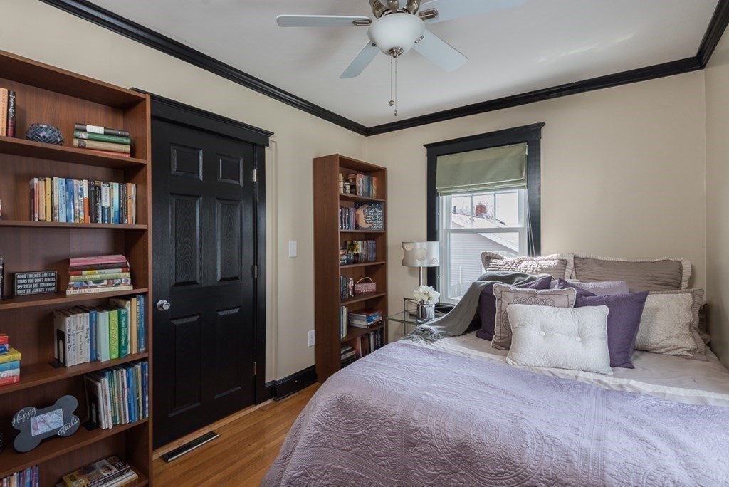 39 Edgemont Road Braintree, MA 02184 - Photo 25 of 39 a bed room with a bed and a book shelf