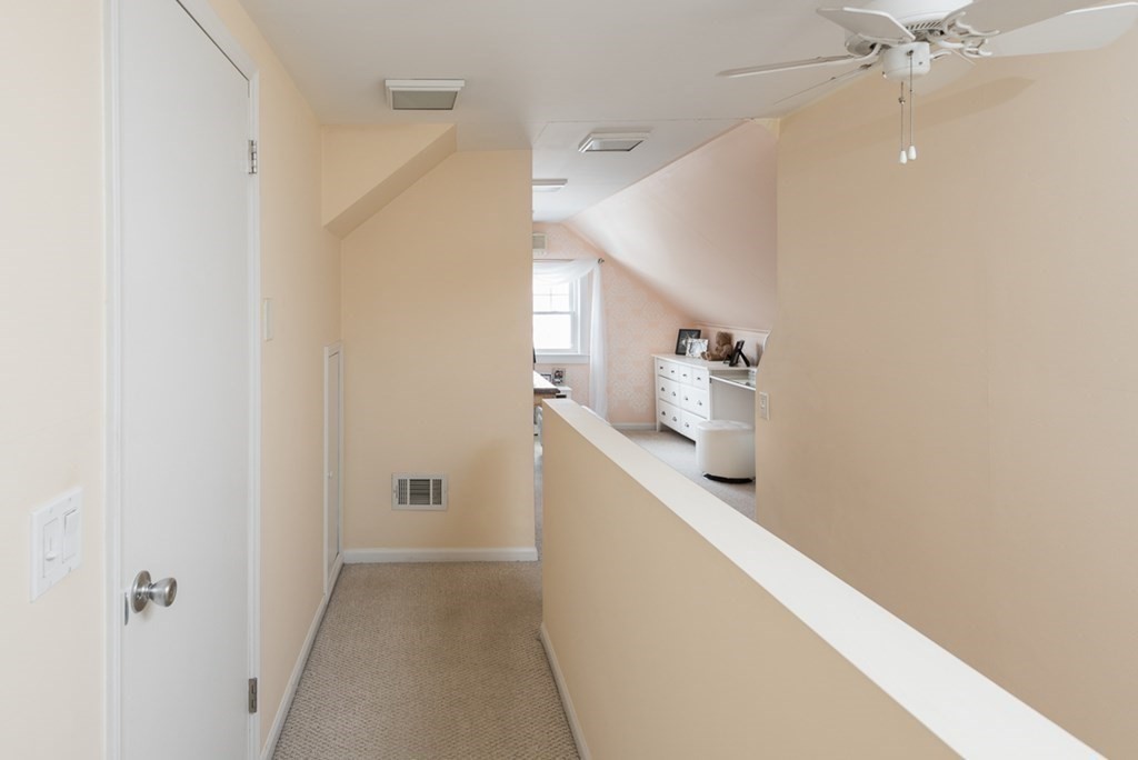 39 Edgemont Road Braintree, MA 02184 - Photo 31 of 39 a view of hallway with stairs and wooden floor