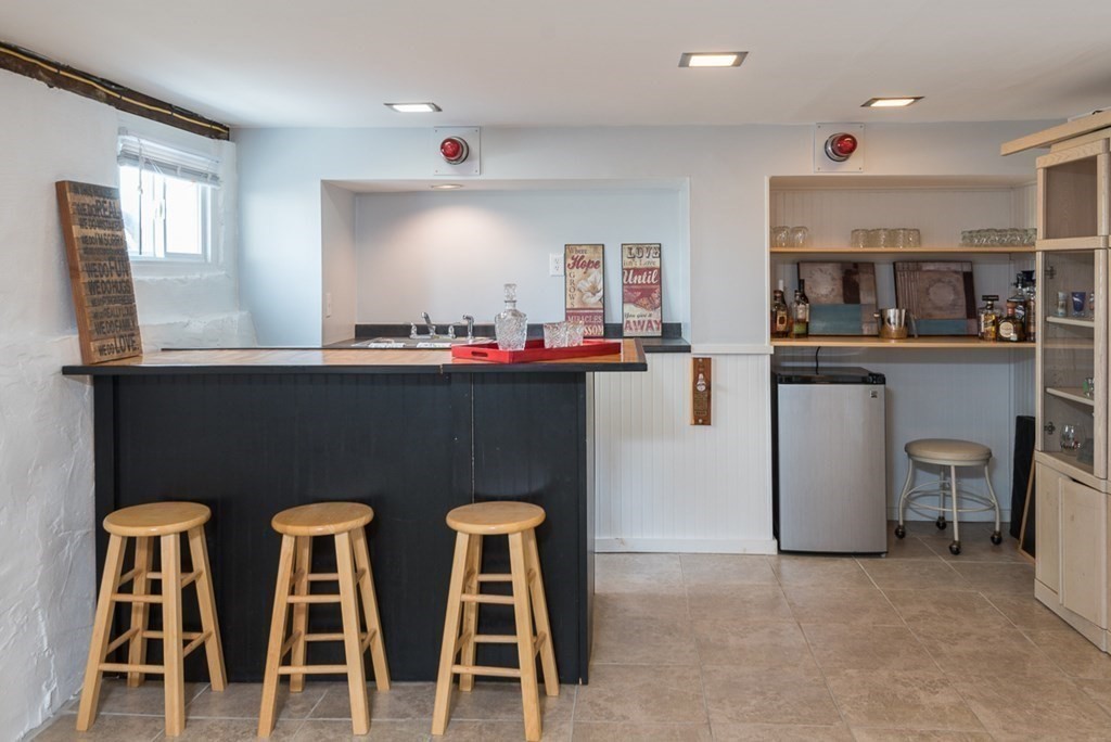 39 Edgemont Road Braintree, MA 02184 - Photo 32 of 39 a kitchen with a dining table chairs and refrigerator