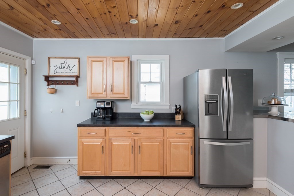 39 Edgemont Road Braintree, MA 02184 - Photo 7 of 39 a kitchen with appliances a refrigerator and cabinets